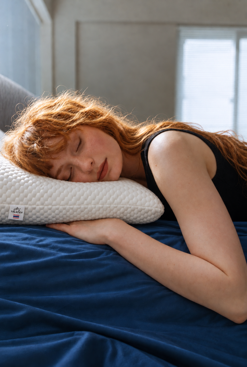 Woman sleeping on a Talatex latex neck pillow